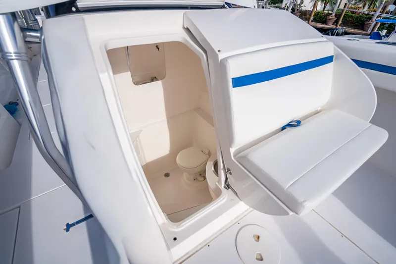 Chasing Chari Yacht Photos Pics 2016 Intrepid 400 Center Console boat interior with open hatch and seating.