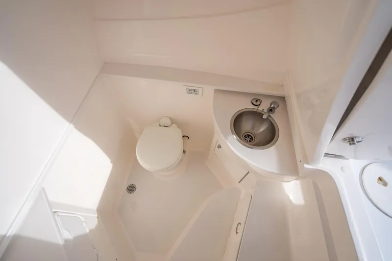 Chasing Chari Yacht Photos Pics 2016 Intrepid 400 Center Console bathroom with toilet and sink.