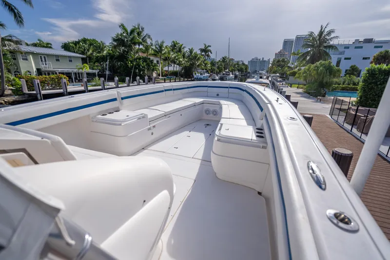 Chasing Chari Yacht Photos Pics 2016 Intrepid 400 Center Console boat docked, featuring spacious seating and sleek design.