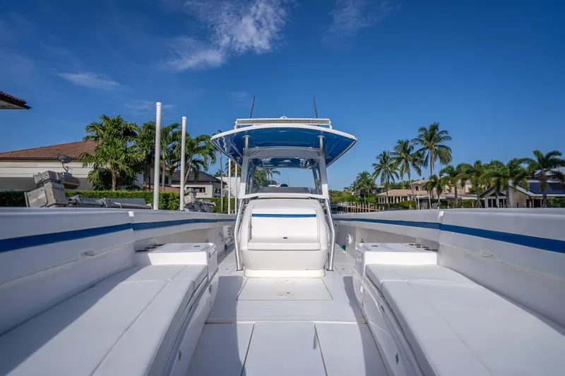 Chasing Chari Yacht Photos Pics 2016 Intrepid 400 Center Console boat with sleek design, docked under clear blue sky.