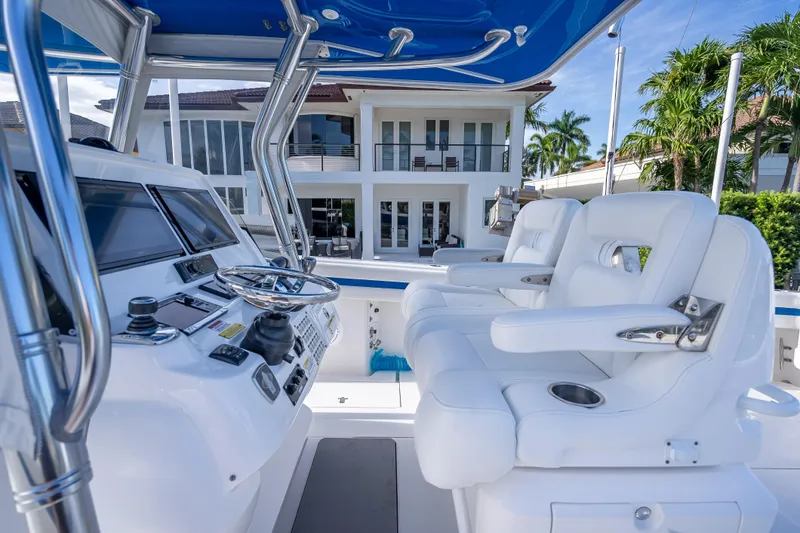 Chasing Chari Yacht Photos Pics 2016 Intrepid 400 Center Console boat interior with luxurious seating and modern controls.