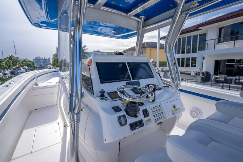 Chasing Chari Yacht Photos Pics 2016 Intrepid 400 Center Console boat with modern helm and dual screens.