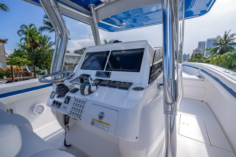 Chasing Chari Yacht Photos Pics 2016 Intrepid 400 Center Console boat helm with modern controls and dual screens.