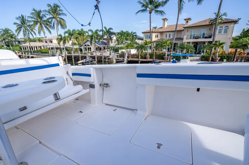 Chasing Chari Yacht Photos Pics 2016 Intrepid 400 Center Console boat interior with waterfront view and palm trees.