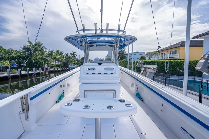 Chasing Chari Yacht Photos Pics 2016 Intrepid 400 Center Console boat docked, featuring spacious deck and modern design.