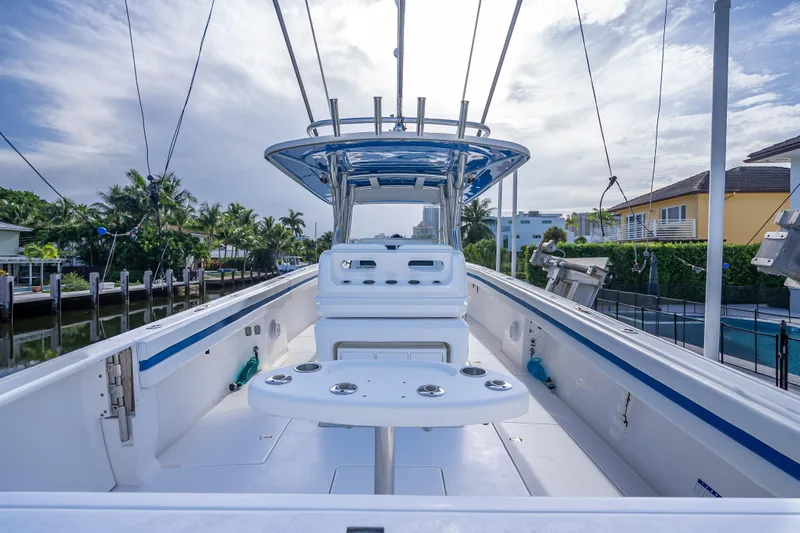Chasing Chari Yacht Photos Pics 2016 Intrepid 400 Center Console boat docked, featuring spacious deck and modern design.