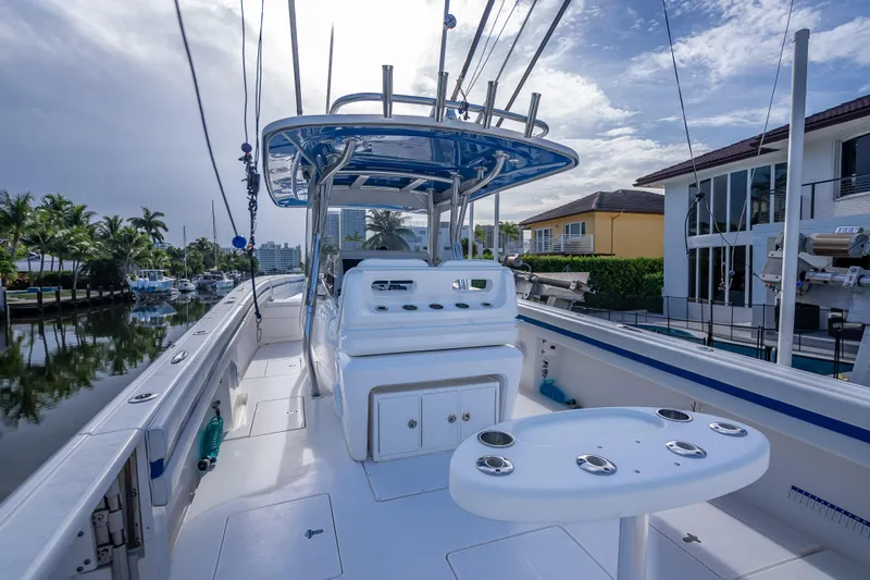 Chasing Chari Yacht Photos Pics 2016 Intrepid 400 Center Console boat docked near waterfront homes.