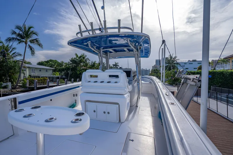 Chasing Chari Yacht Photos Pics 2016 Intrepid 400 Center Console boat docked, featuring spacious deck and modern design.