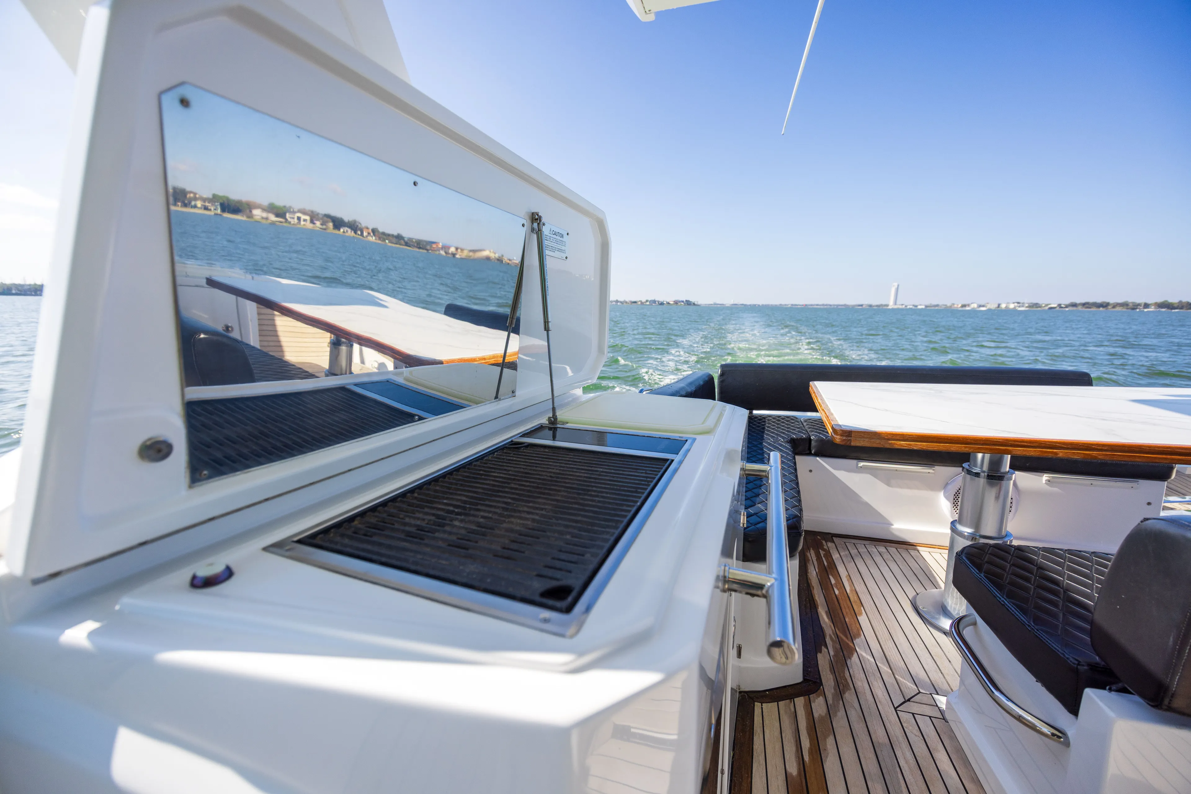  Yacht Photos Pics 2018 Azimut Verve 40 yacht with grill and table on deck.