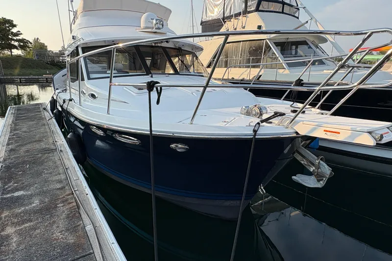 Miller Time Yacht Photos Pics 2018 Cutwater C-30 CB boat docked at marina, sleek design, blue hull.