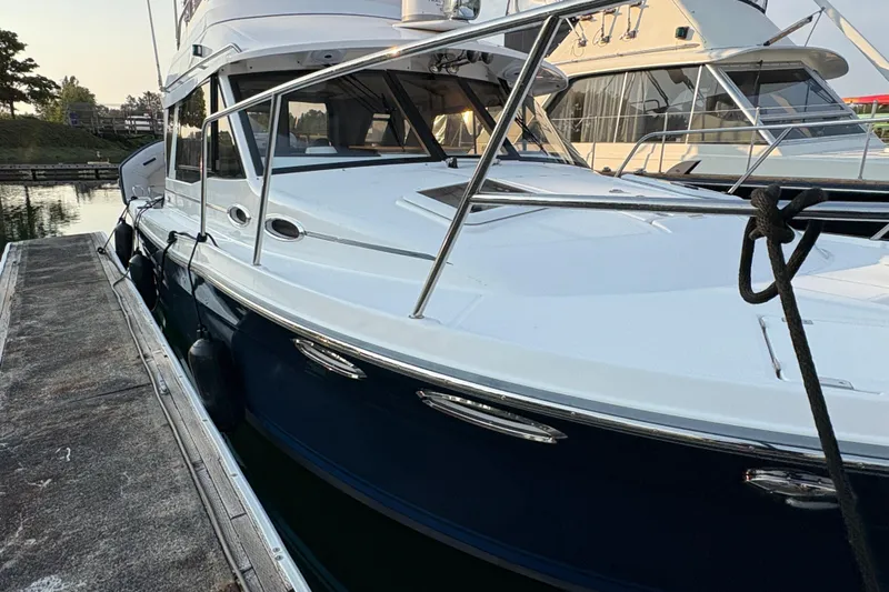 Miller Time Yacht Photos Pics 2018 Cutwater C-30 CB boat docked at marina, side view.
