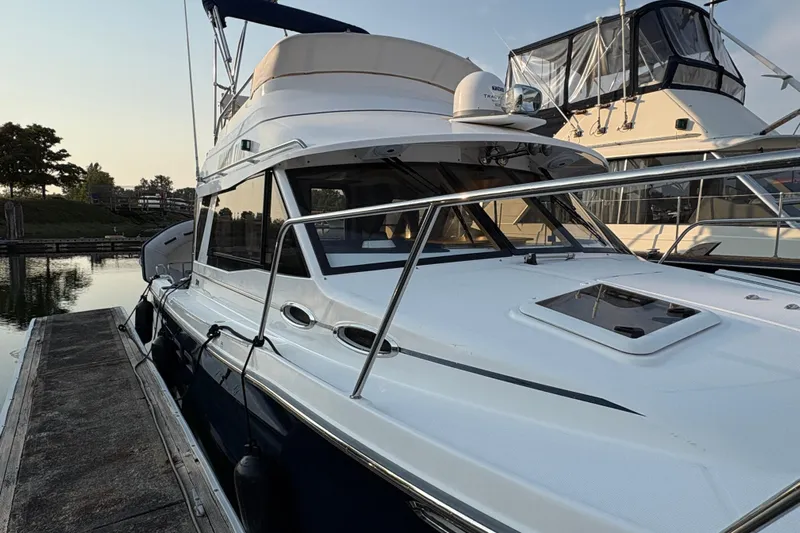 Miller Time Yacht Photos Pics 2018 Cutwater C-30 CB boat docked, featuring sleek design and modern amenities.