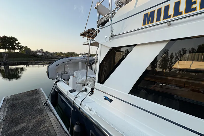 Miller Time Yacht Photos Pics 2018 Cutwater C-30 CB yacht docked at a serene marina.