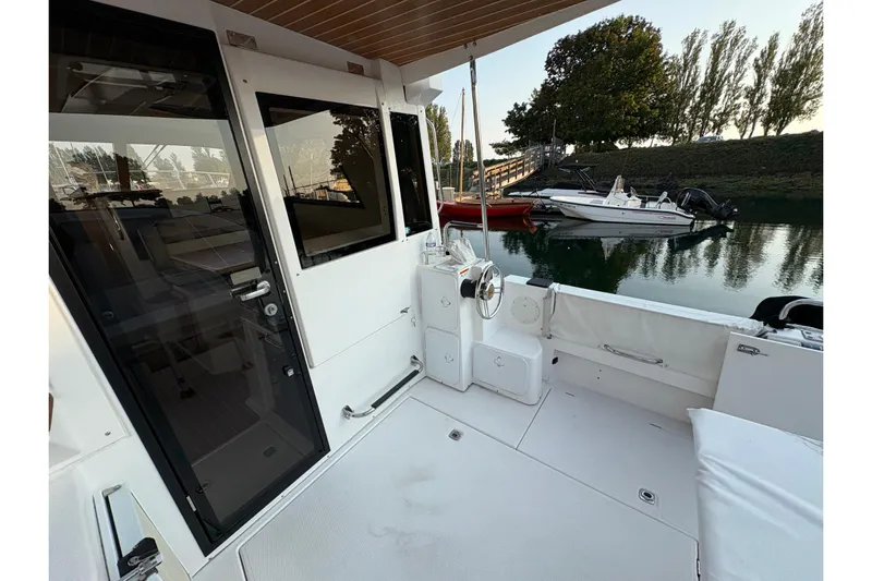 Miller Time Yacht Photos Pics 2018 Cutwater C-30 CB boat deck with seating, docked near other boats.