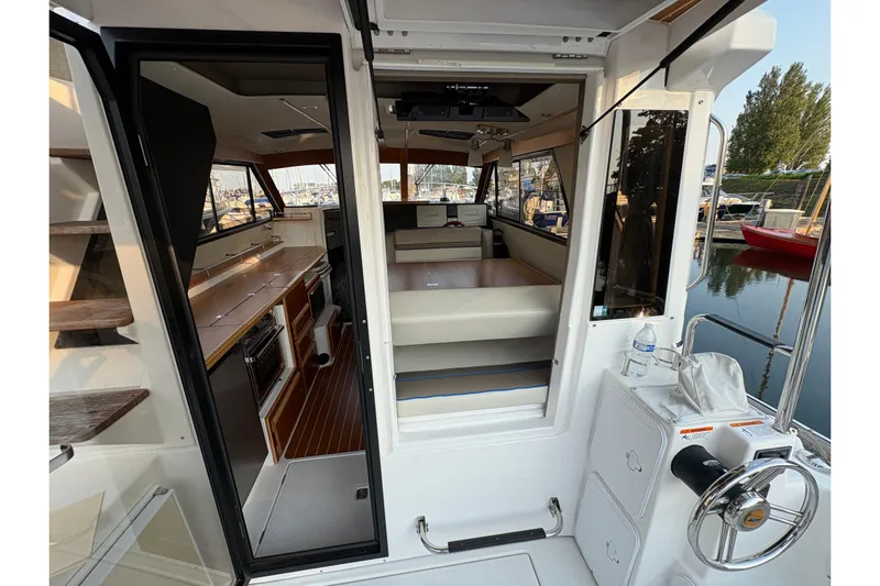 Miller Time Yacht Photos Pics Interior view of 2018 Cutwater C-30 CB boat, showcasing cabin and helm area.