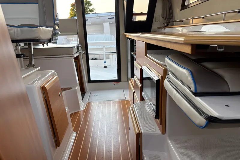 Miller Time Yacht Photos Pics Interior of 2018 Cutwater C-30 CB boat with wood flooring and modern amenities.