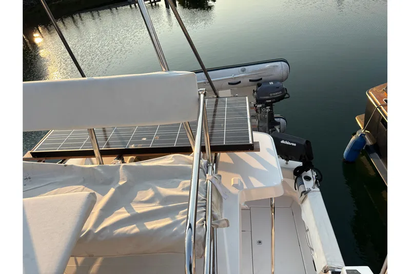 Miller Time Yacht Photos Pics 2018 Cutwater C-30 CB boat with solar panel and outboard motor on calm water.