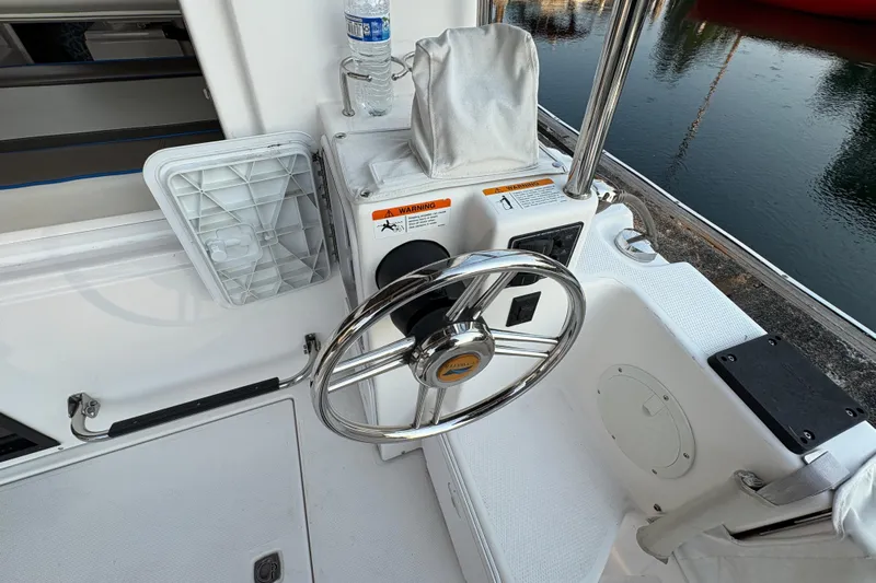 Miller Time Yacht Photos Pics Steering wheel of a 2018 Cutwater C-30 CB boat docked by the water.