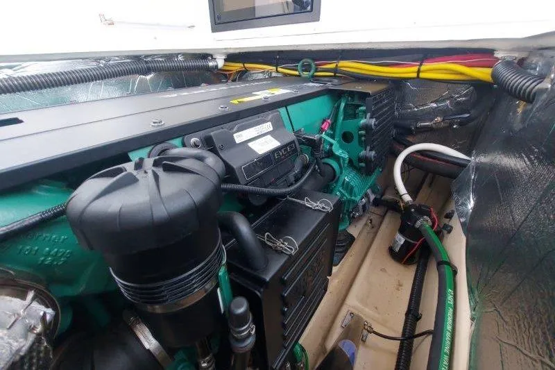 Miller Time Yacht Photos Pics Engine compartment of a 2018 Cutwater C-30 CB boat, showcasing detailed mechanical components.