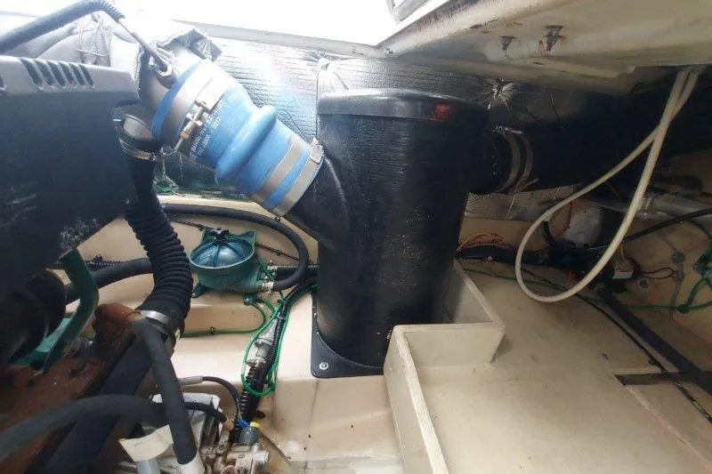 Miller Time Yacht Photos Pics Engine compartment of a 2018 Cutwater C-30 CB boat, showing hoses and components.