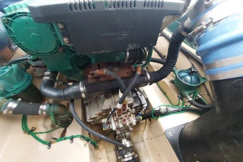 Miller Time Yacht Photos Pics Engine compartment of a 2018 Cutwater C-30 CB boat, showcasing mechanical components and hoses.