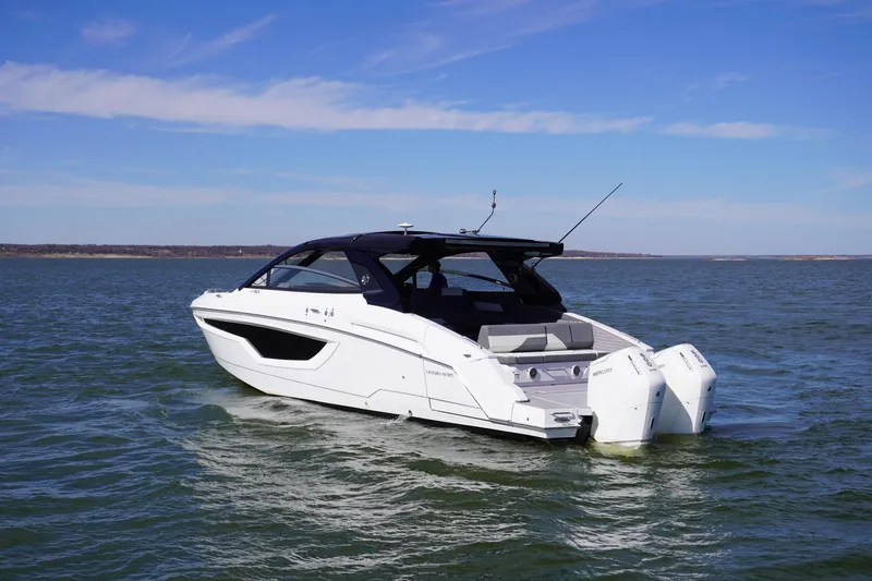  Yacht Photos Pics 2023 Cruisers Yachts 42 GLS OB on open water, showcasing sleek design and powerful outboard engines.