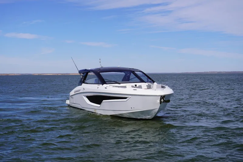  Yacht Photos Pics 2023 Cruisers Yachts 42 GLS OB on open water under clear blue sky.