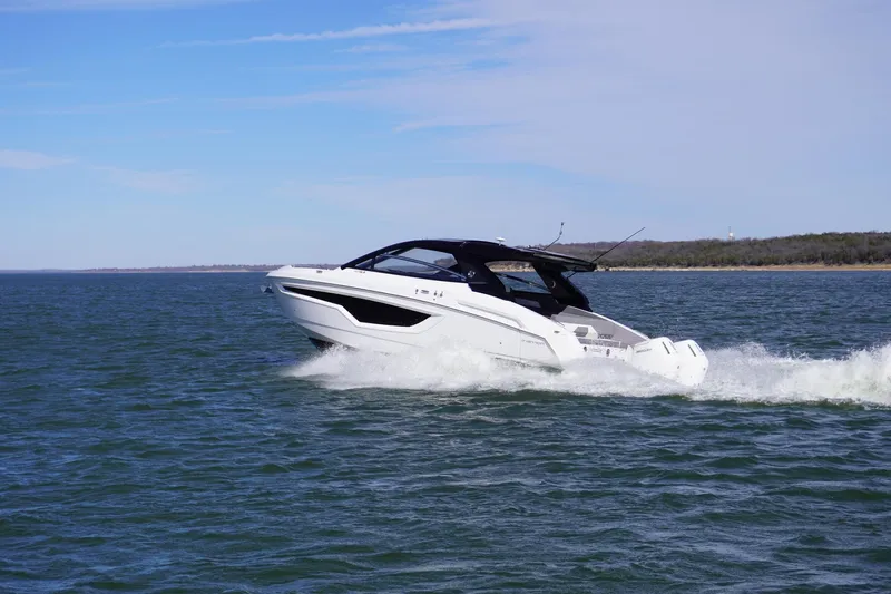  Yacht Photos Pics 2023 Cruisers Yachts 42 GLS OB cruising on open water under clear skies.