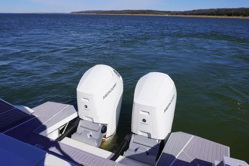  Yacht Photos Pics 2023 Cruisers Yachts 42 GLS OB with dual Mercury outboard engines on open water.