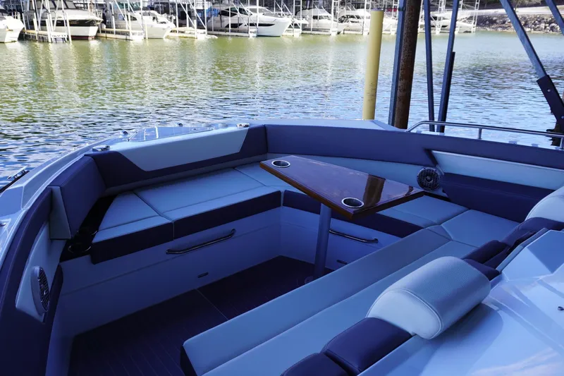  Yacht Photos Pics Luxurious seating area on 2023 Cruisers Yachts 42 GLS OB, docked by the marina.