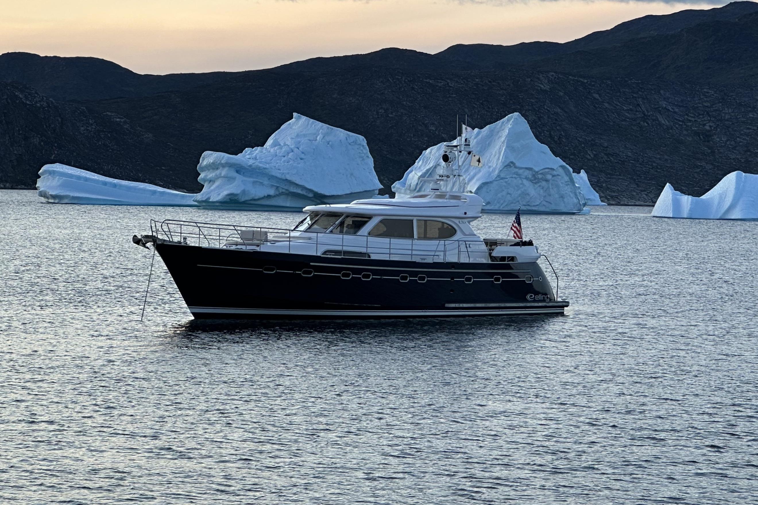 Elling E6 yacht, 2021 model, cruising near icebergs in serene waters.