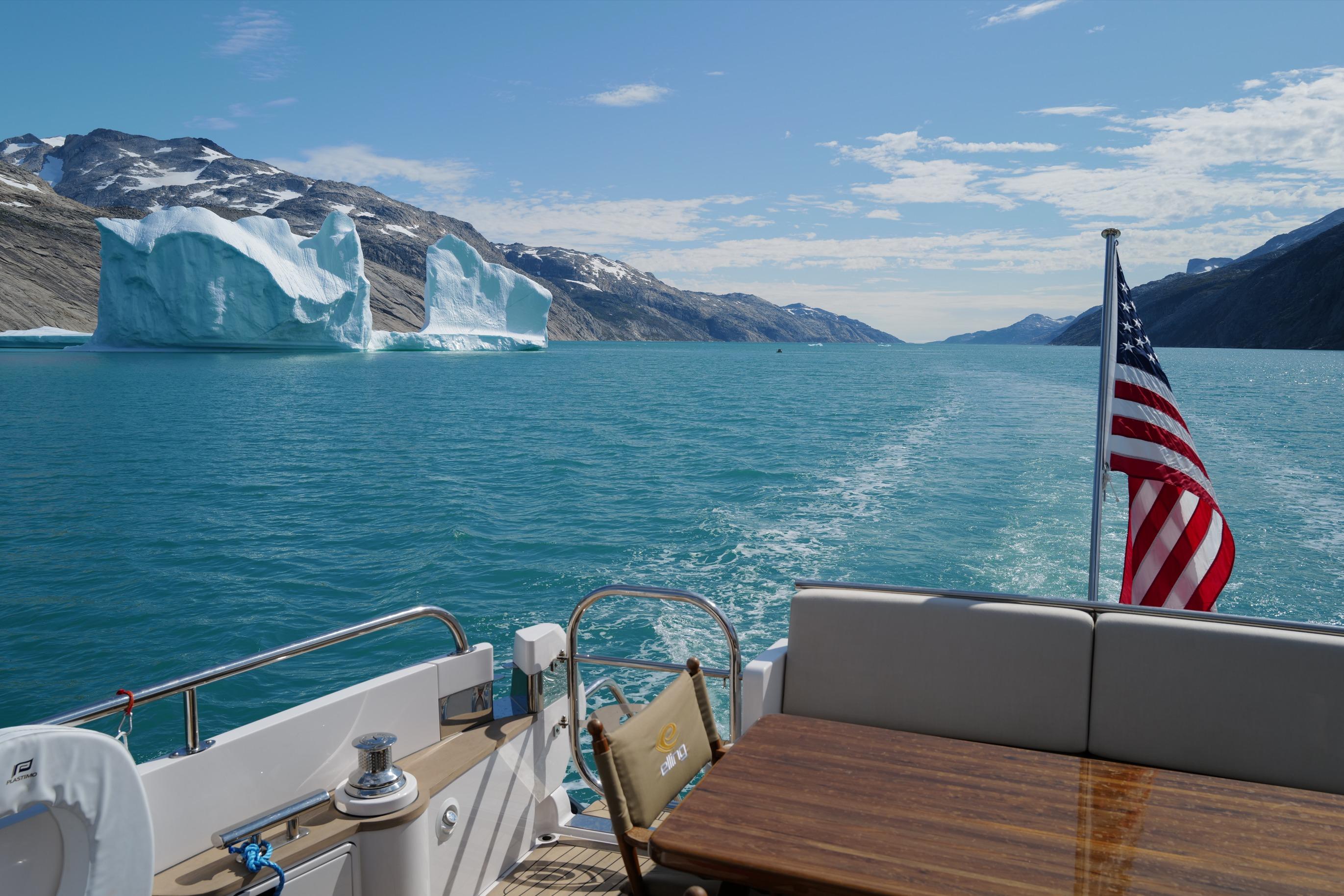 Elling E6 yacht cruising near icebergs in scenic waters, 2021.