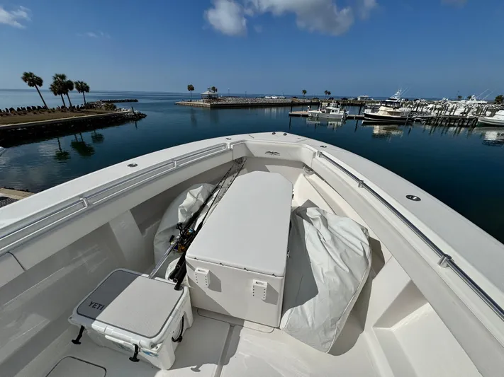  Yacht Photos Pics 2016 Invincible 39' Open Fisherman boat docked in a serene marina setting.