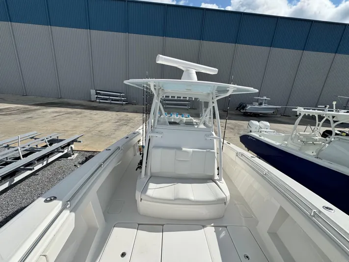  Yacht Photos Pics 2016 Invincible 39' Open Fisherman boat docked, featuring spacious seating and modern design.
