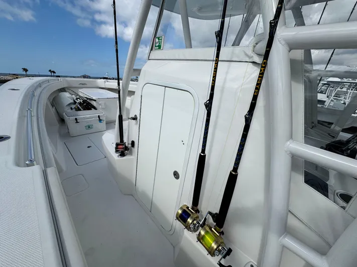  Yacht Photos Pics 2016 Invincible 39' Open Fisherman boat with fishing rods on deck.