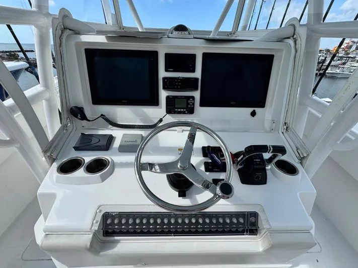  Yacht Photos Pics 2016 Invincible 39' Open Fisherman helm with dual screens and steering wheel.
