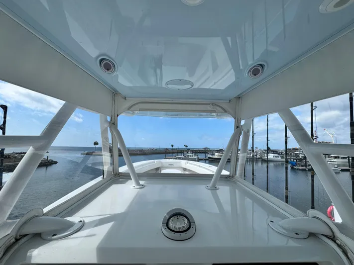  Yacht Photos Pics 2016 Invincible 39' Open Fisherman boat at marina, showcasing helm and ocean view.