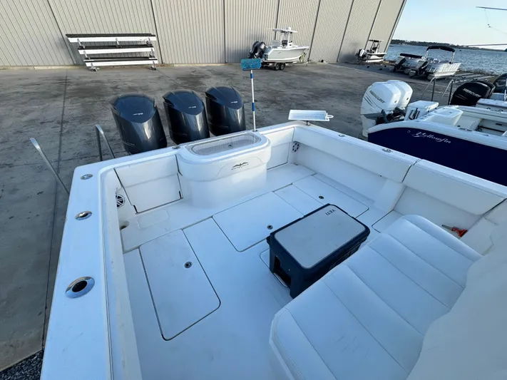  Yacht Photos Pics 2016 Invincible 39' Open Fisherman boat with triple outboard engines docked at a marina.