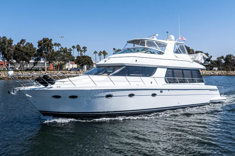  Yacht Photos Pics 2003 Carver 570 Voyager Pilothouse yacht cruising on a sunny day.