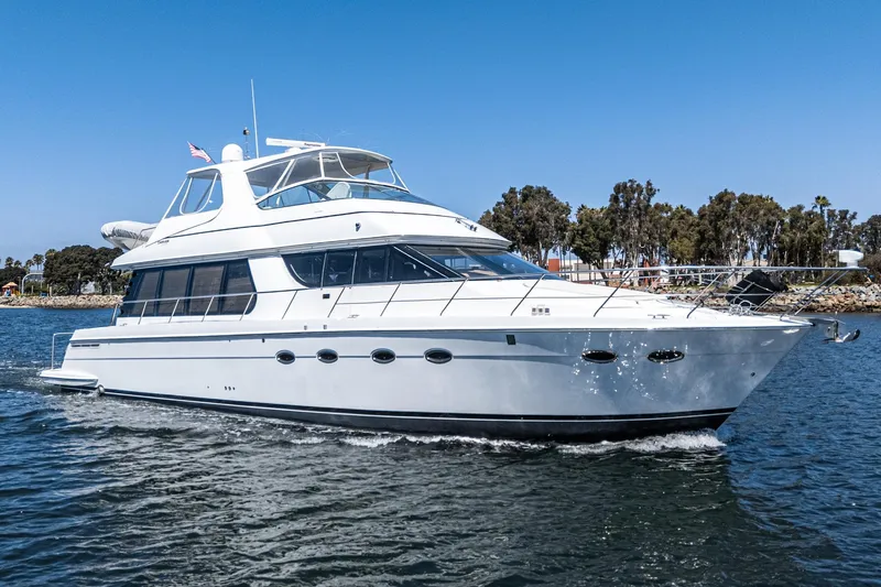  Yacht Photos Pics 2003 Carver 570 Voyager Pilothouse yacht cruising on a sunny day.