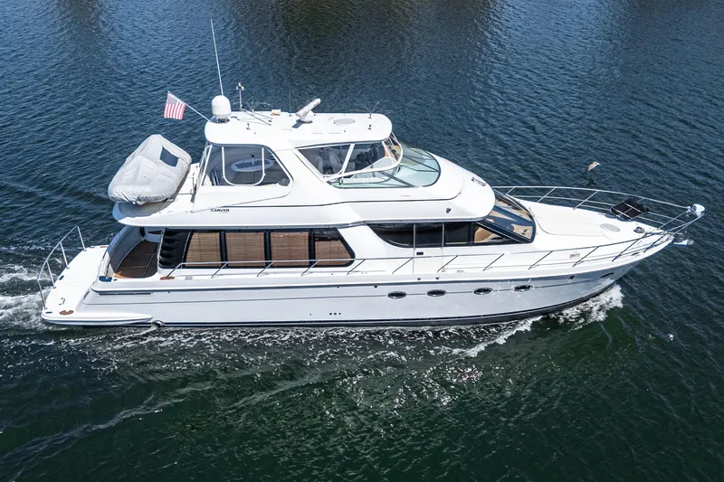  Yacht Photos Pics 2003 Carver 570 Voyager Pilothouse yacht cruising on open water.