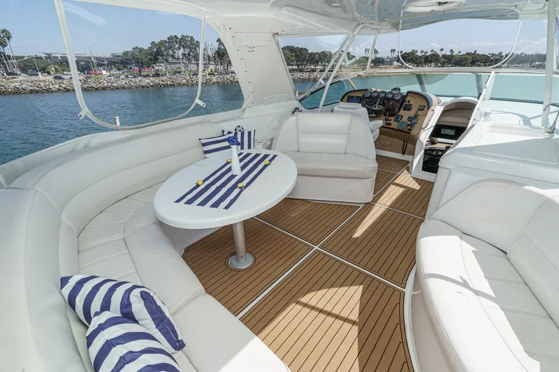  Yacht Photos Pics Luxurious 2003 Carver 570 Voyager Pilothouse interior with elegant seating and nautical decor.