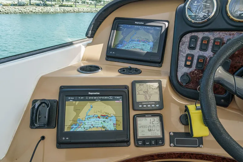  Yacht Photos Pics Control panel of a 2003 Carver 570 Voyager Pilothouse with navigation screens and gauges.
