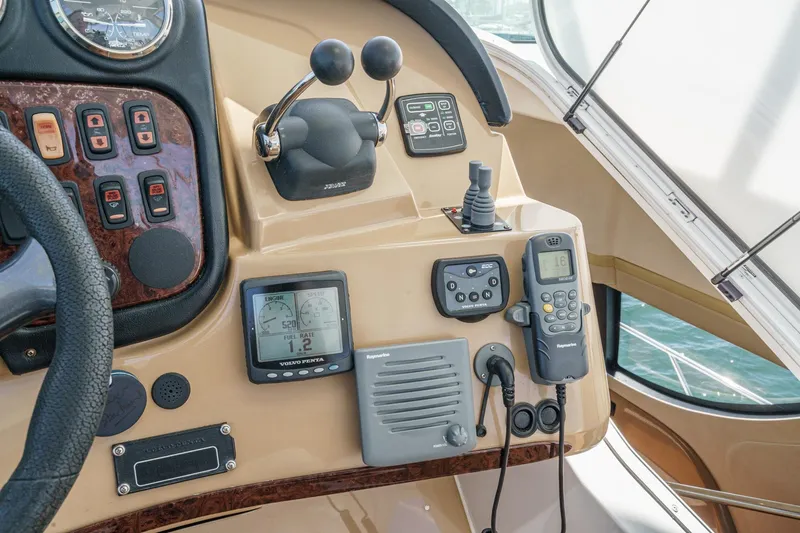  Yacht Photos Pics Control panel of 2003 Carver 570 Voyager Pilothouse with navigation and communication equipment.