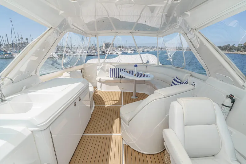  Yacht Photos Pics Luxurious 2003 Carver 570 Voyager Pilothouse yacht interior with elegant seating and ocean view.