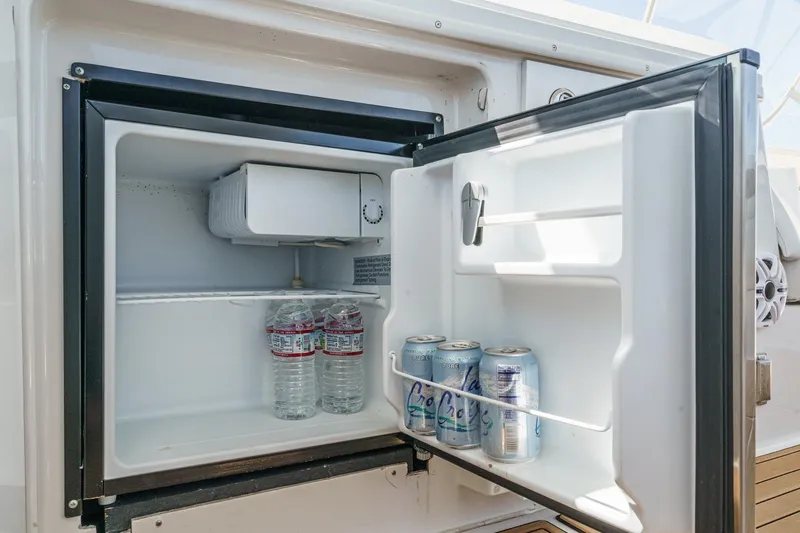  Yacht Photos Pics Mini fridge on 2003 Carver 570 Voyager Pilothouse with drinks inside.