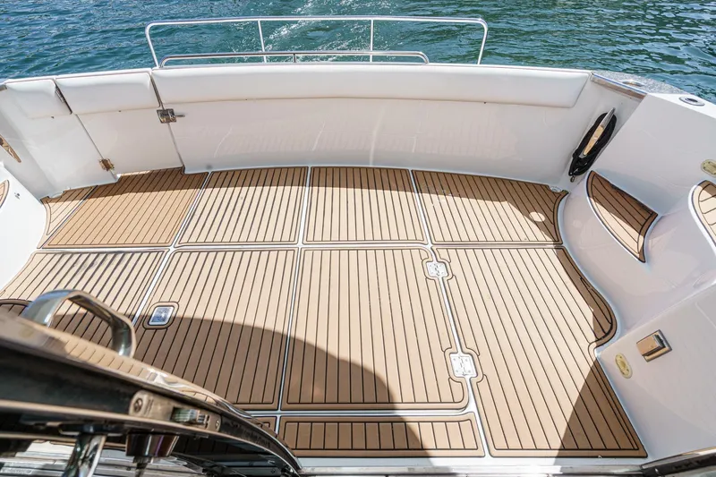  Yacht Photos Pics 2003 Carver 570 Voyager Pilothouse deck with teak flooring, overlooking water.