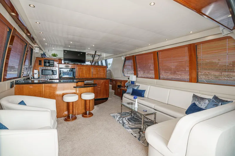  Yacht Photos Pics Luxurious interior of 2003 Carver 570 Voyager Pilothouse with modern kitchen and seating area.