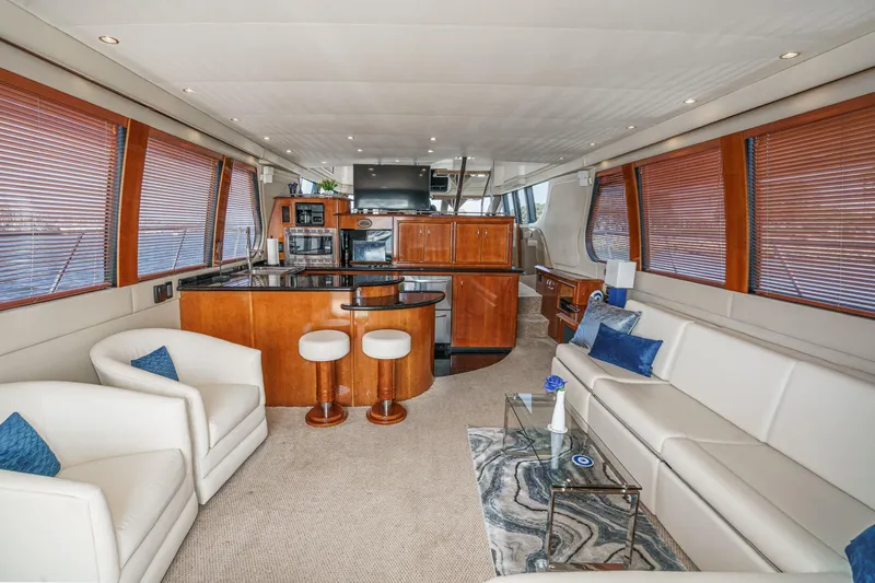  Yacht Photos Pics Luxurious interior of 2003 Carver 570 Voyager Pilothouse yacht with elegant seating and modern amenities.