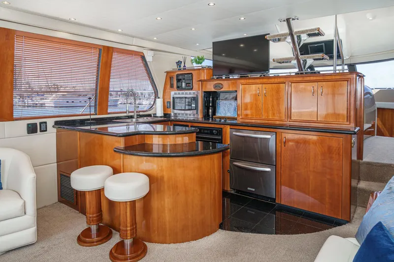  Yacht Photos Pics Luxurious interior of 2003 Carver 570 Voyager Pilothouse yacht with modern kitchen amenities.